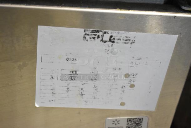 Giles EOF-24 stainless steel commercial fryer label, indicating manufacturer and model specifics, shows wear.
