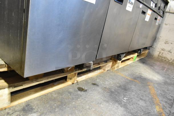 Giles EOF-24 stainless steel 3-bay deep fat fryer with center dumping station, commercial casters, 480 volts, 3 phase.