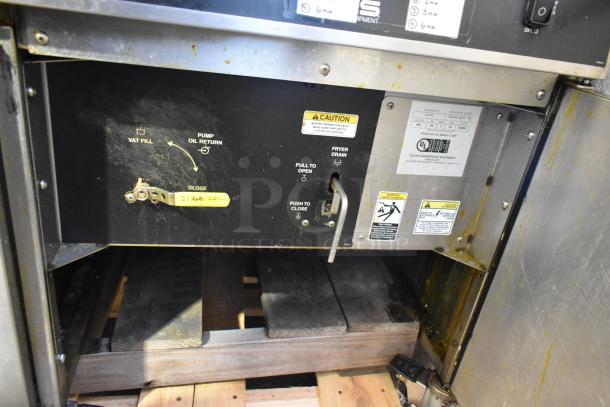 Giles EOF-24 stainless steel commercial deep fat fryer with 3 bays, center dumping station, and casters. 480V, 3 phase.