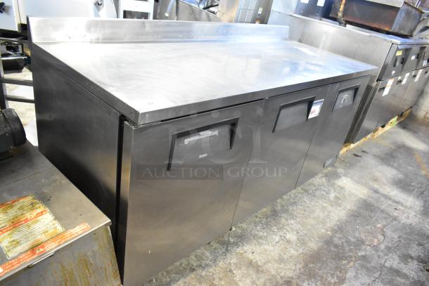 True TWT-72 Commercial 3 Door Work Top Cooler, stainless steel, on casters, 115V, 1 phase. Marks indicate light use.