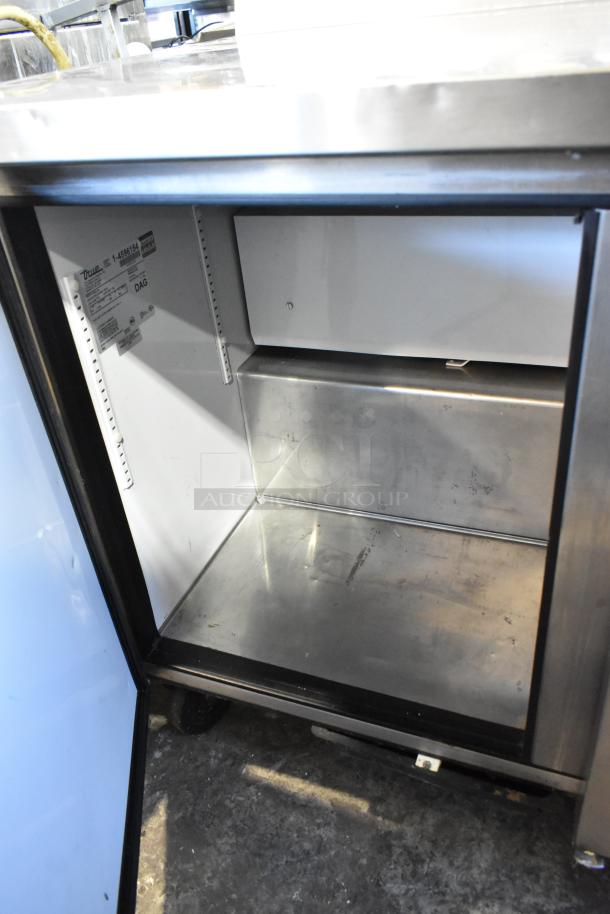 True TWT-72 stainless steel 3-door work top cooler on casters, 115 volts, 1 phase, interior view showing clean shelves.