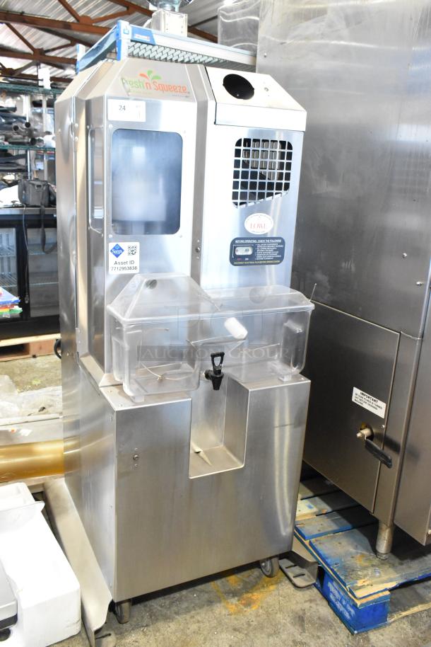 JBT Fresh N Squeeze POS-1 stainless steel citrus juicer on casters. Commercial floor style, 115V, 1 phase, with visible control labels.