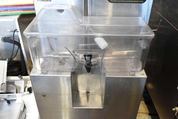 JBT Fresh N Squeeze POS-1 citrus juicer, stainless steel, commercial floor style, on casters, 115V, 1 phase.