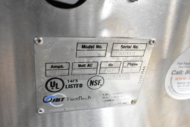 JBT Fresh N Squeeze POS-1 citrus juicer, stainless steel, commercial casters, 115V, 1 Phase, model and serial numbers displayed.