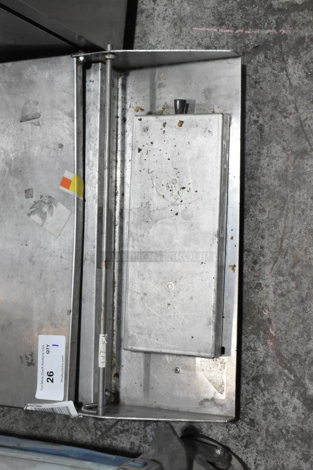 Metal countertop wrapping station, model 5000156. Features visible wear. 115 Volts, 1 Phase. Auction tag and markings shown.