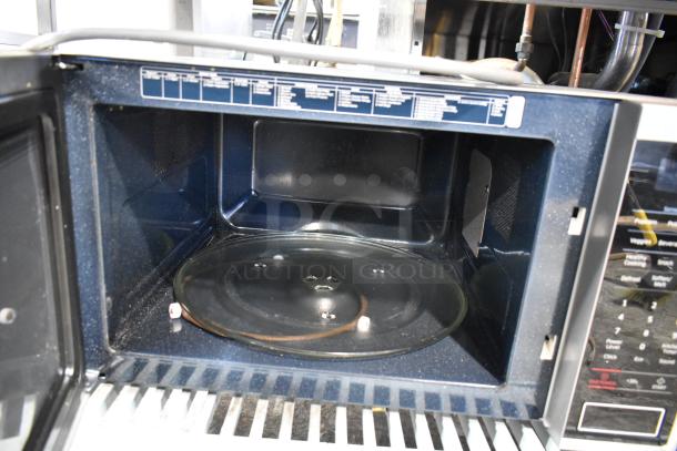 2018 Samsung MS14K6000AS countertop microwave, stainless steel finish, with glass turntable. 120 volts, 1 phase.