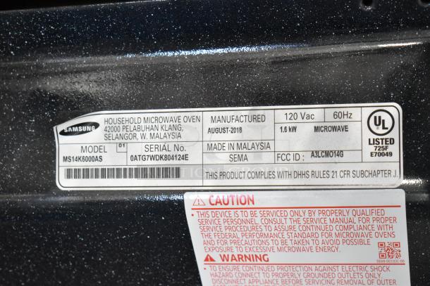 2018 Samsung MS14K6000AS countertop microwave oven label, 120V, 60Hz, 1.6kW, made in Malaysia, serial 0ATG7WDK804124E.