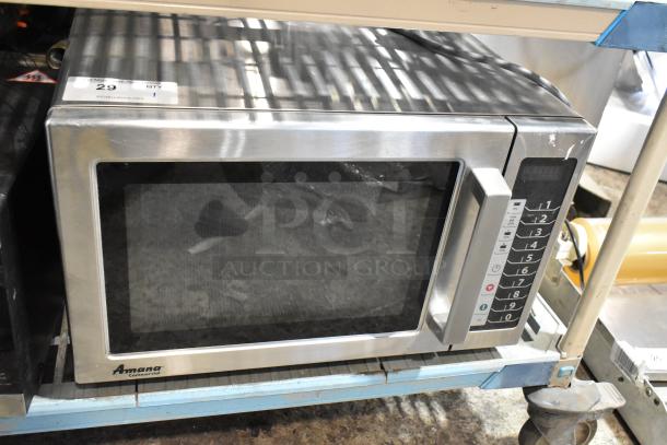 2017 Amana RCS10TS stainless steel commercial countertop microwave oven, 120 volts, 1 phase. Visible keypad and label.