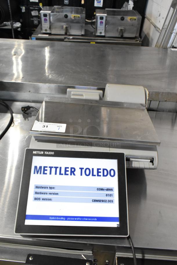 Mettler Toledo UCCW countertop scale, tested and working, metal construction, digital display showing hardware and BIOS versions.