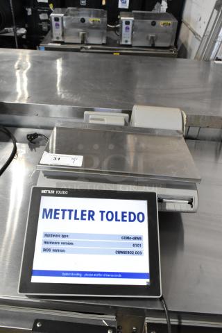 Mettler Toledo UCCW countertop scale, tested and working, metal construction, digital display showing hardware and BIOS versions.