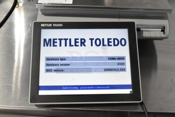 Mettler Toledo UCCW commercial countertop scale, metal, 120/240V, 1 phase, tested and working, with visible hardware and BIOS details.