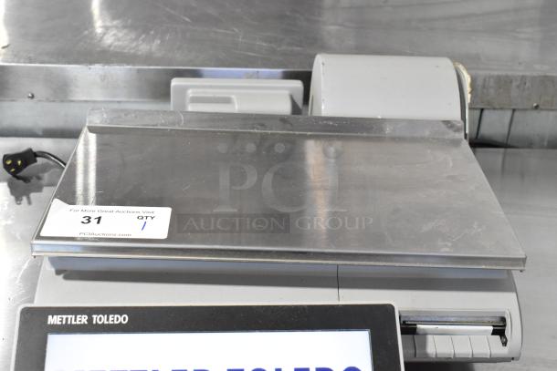 Mettler Toledo UCCW commercial countertop scale, metal design, tested, 120/240V, 1 phase, label “31 QTY 1” visible.