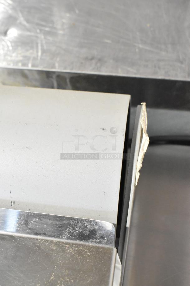 Mettler Toledo UCCW metal commercial countertop scale, 120/240 volts, 1 phase. Tested and working. Signs of wear visible.