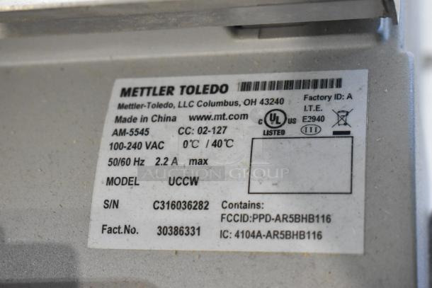 Mettler Toledo UCCW metal commercial countertop scale label, showing specifications and compliance markings.