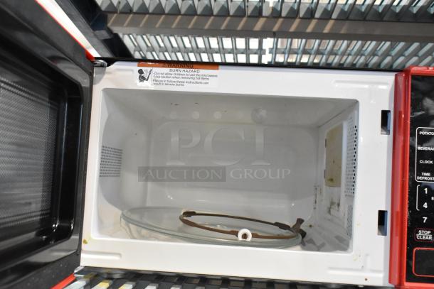 2024 Mainstays MS8436127995-02 metal microwave oven, red trim, includes plate, warning label, 120 volts, 1 phase.