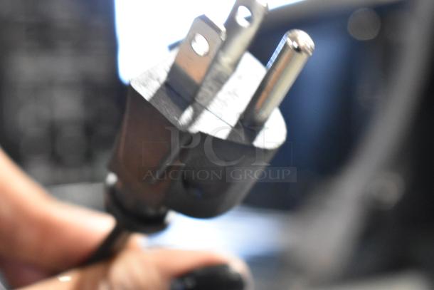 Close-up of a power plug for the 2024 Mainstays MS8436127995-01 Microwave, 120V, 1 Phase.