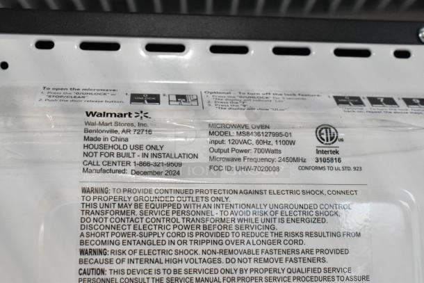 2024 Mainstays MS8436127995-01 metal countertop microwave, 120V, 700W output, 2450MHz, made in December 2024, for household use.