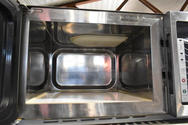 Amana RCS10TS stainless steel commercial microwave oven, clean interior, 120V, 1 phase, control panel visible.