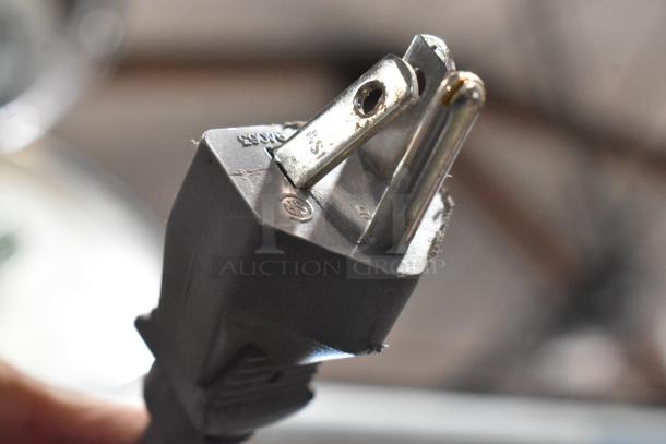 Close-up view of the power plug for an Amana RCS10TS stainless steel commercial countertop microwave oven, 120 volts, 1 phase.