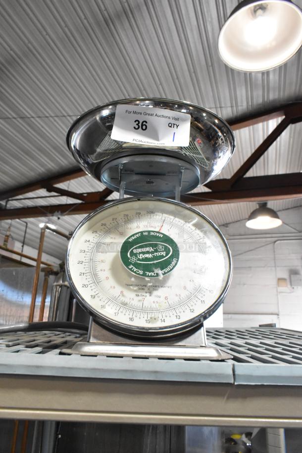 Yamaha SM(N) metal countertop food portioning scale with stainless steel pan, analog dial, and label marked with "36 QTY 1".