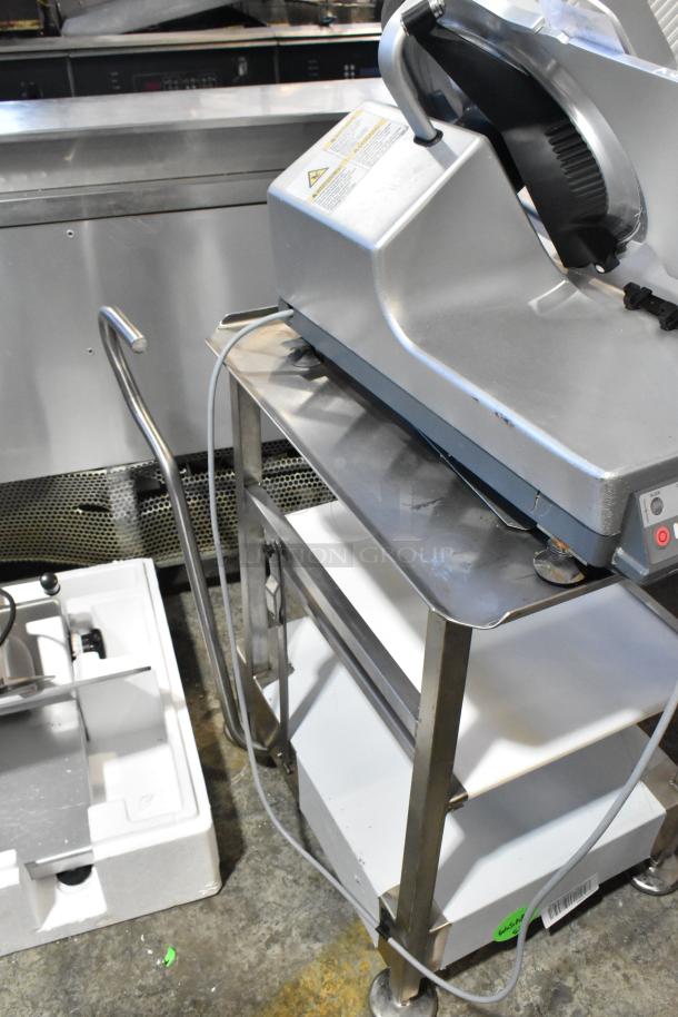 2016 Bizerba GSP HD meat slicer on stainless steel equipment stand, 120 volts, 1 phase; includes safety and operation labels.