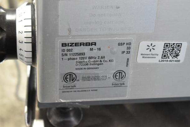 2016 Bizerba GSP HD meat slicer, model M-16, 120V. ID 002, S/N 11225893. Includes face-to-face stainless steel stand.