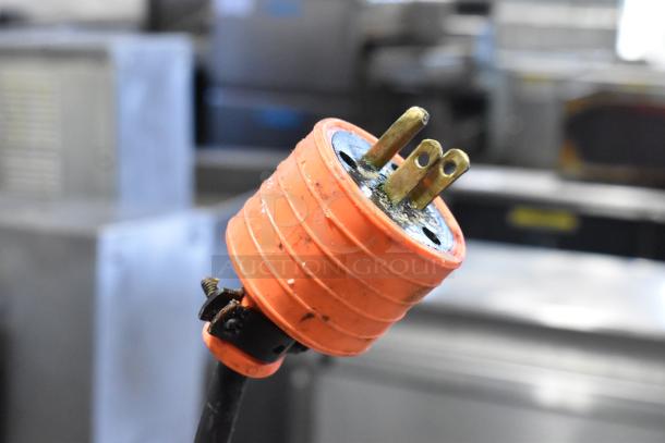 Orange and black power plug connected to the Bizerba Commercial Meat Slicer, 120 Volts, 1 Phase.