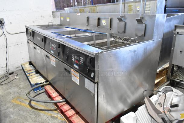 Giles EOF-24 stainless steel commercial electric 3-bay fryer with center dumping station, 480V, 3 phase, on casters.