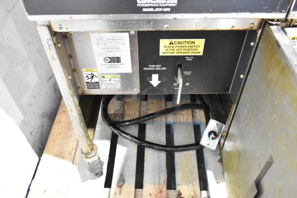 Giles EOF-24 Stainless Steel Commercial Electric 3 Bay Deep Fat Fryer with center dumping, 480V, 3 Phase, on casters.