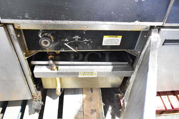 Giles EOF-24 stainless steel 3-bay deep fat fryer with center dumping station, on commercial casters, 480 volts, 3 phase.
