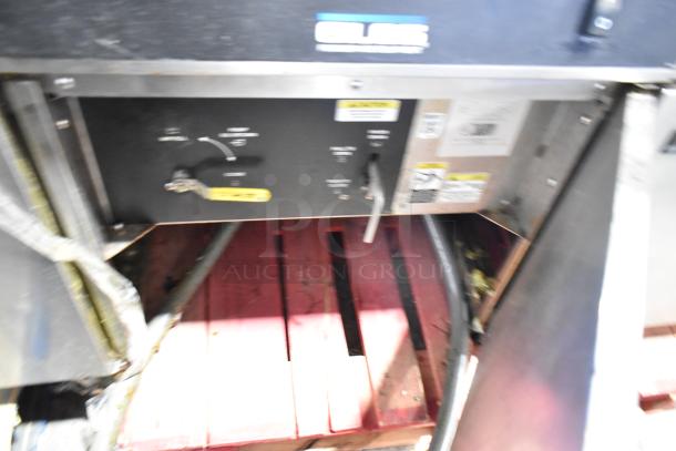 Giles EOF-24 stainless steel 3-bay deep fat fryer, electric 480V, with center dumping station, on commercial casters.