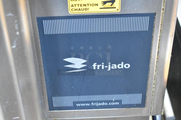 Fri-jado STG7-P stainless steel commercial rotisserie oven, electric, 208V, 3 Phase, on casters, brand label visible.