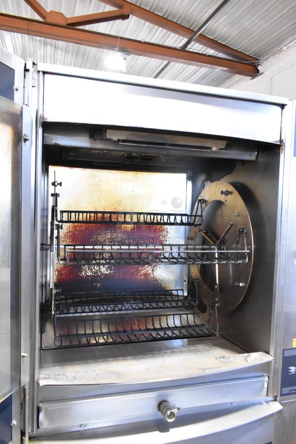 Fri-jado STG7-P stainless steel commercial rotisserie oven, electric, 208V, 3 phase with commercial casters, interior view.