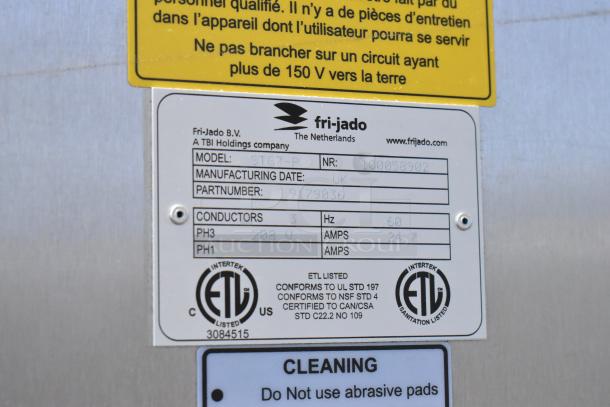 Fri-jado STG7-P stainless steel rotisserie oven label showing model, volts, amps, and ETL certification.