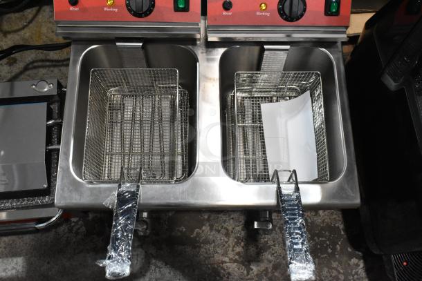 Avantco 177F202 stainless steel 2-bay commercial fryer, brand new, with 2 metal baskets and lids. 208-240V, 1-phase.
