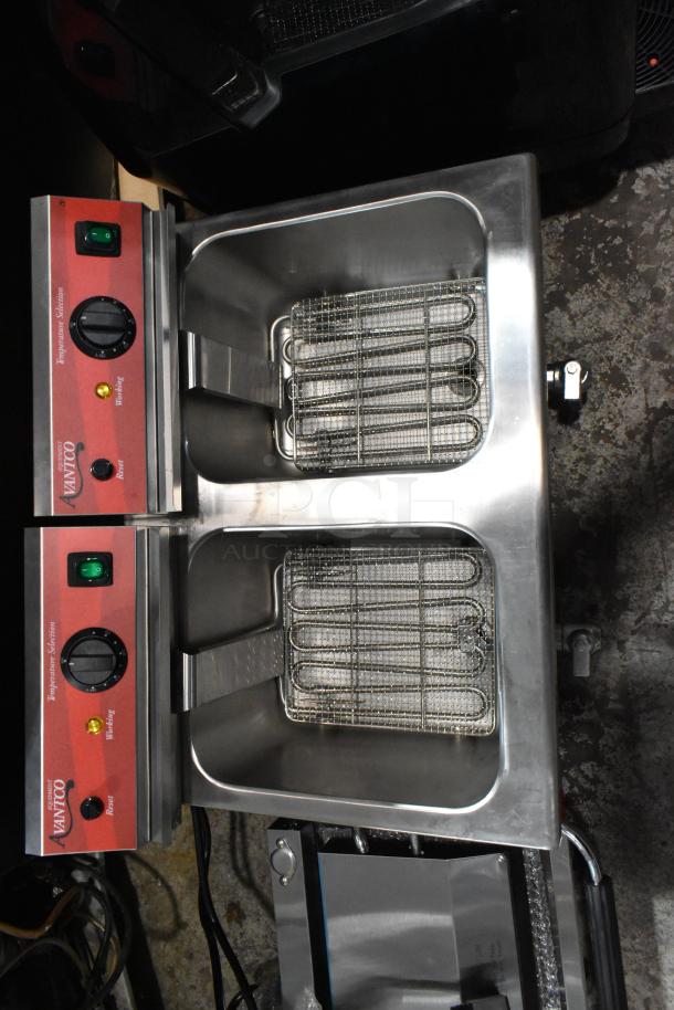 Brand new Avantco 177F202 stainless steel 2-bay fryer with two metal fry baskets and lids, 208-240V, 1 phase.