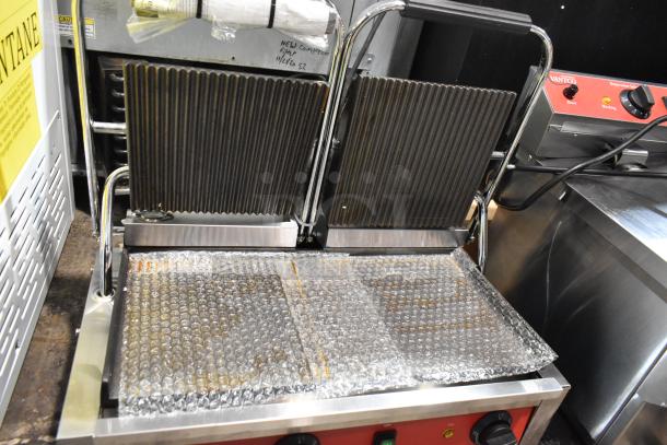 Brand new Avantco 177PG400GS double panini press, stainless steel, electric, with bubble wrap protection, 120V, 1 phase.