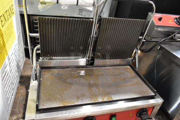 BRAND NEW Avantco 177PG400GS Stainless Steel Double Panini Press with scratches. Electric, 120V, 1 Phase, countertop model.