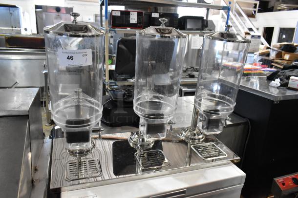 Chrome finish and clear poly 3 hopper dry goods dispenser, brand new but labeled "scratch and dent."