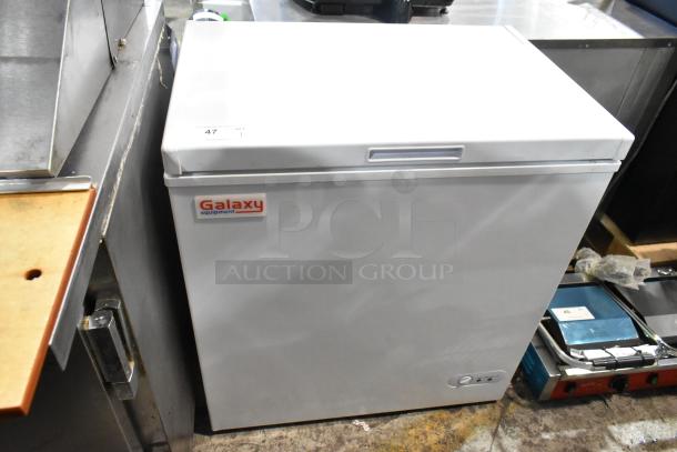 Galaxy 177CF5 metal chest freezer with hinge lid, 115 volts, 1 phase, Galaxy label visible, in good condition.