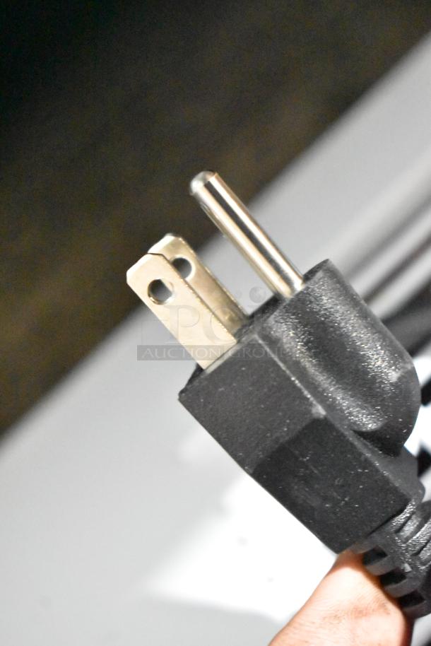 Close-up of a standard 115-volt, 1-phase power plug for a Galaxy 177CF5 metal chest freezer, hinge lid model.
