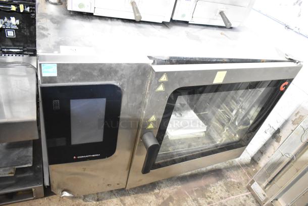 Convotherm stainless steel commercial combi convection oven, door does not close, visible control panel.