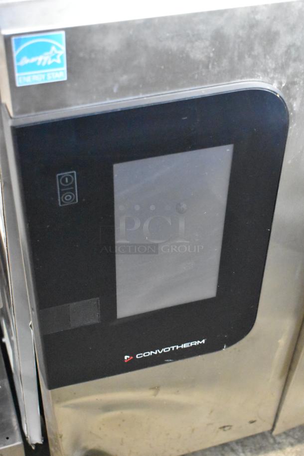 Convotherm stainless steel commercial combi convection oven. Door does not close fully. Energy Star label visible.