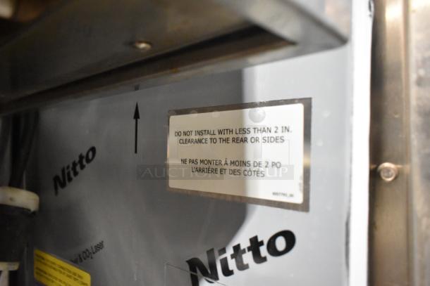 Convotherm stainless steel commercial combi convection oven, door does not close. Label advises 2 in. clearance for installation.