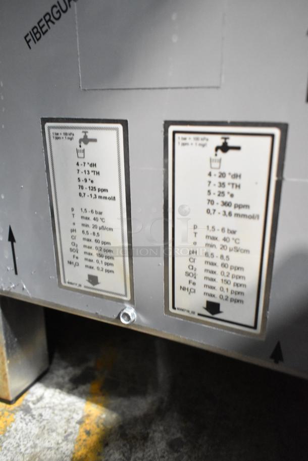 Convotherm stainless steel commercial combi convection oven with technical specifications on labels; door does not close.