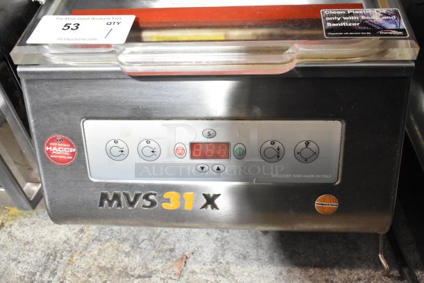 MiniPack MVS31X stainless steel vacuum sealer, display panel showing digital controls, HACCP label, Italy made.
