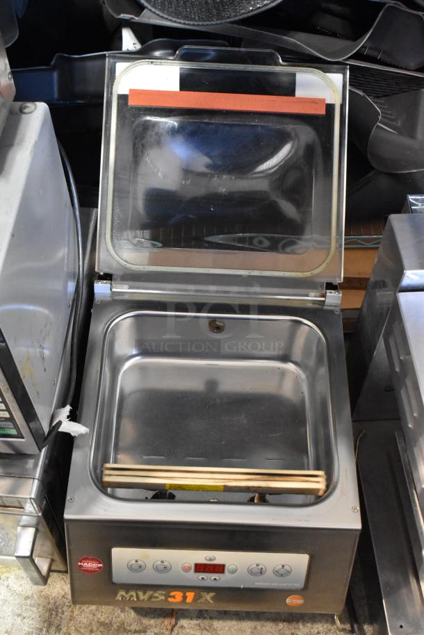 MiniPack MVS31X stainless steel commercial vacuum sealer in good condition. Features digital controls and countertop design.