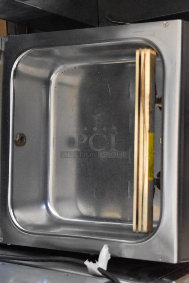 MiniPack MVS31X stainless steel vacuum sealer, commercial countertop model, inner chamber view, clean condition.