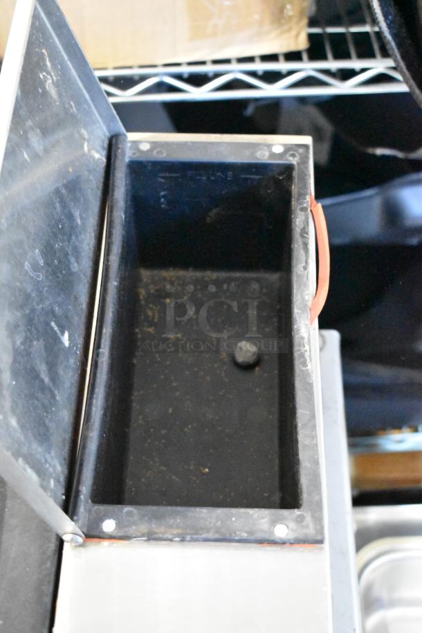 Nemco 6600 stainless steel commercial countertop food warmer, open lid, showing interior. Used condition. 120 volts, 1 phase.