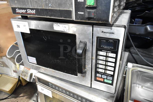 Panasonic NE-1054F stainless steel commercial microwave oven, used condition, 120V, 1 Phase, preset menu keypad visible.
